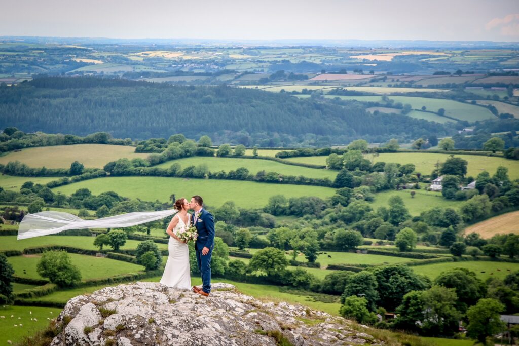 Couple on the rocks at the church - L Spinks Photography